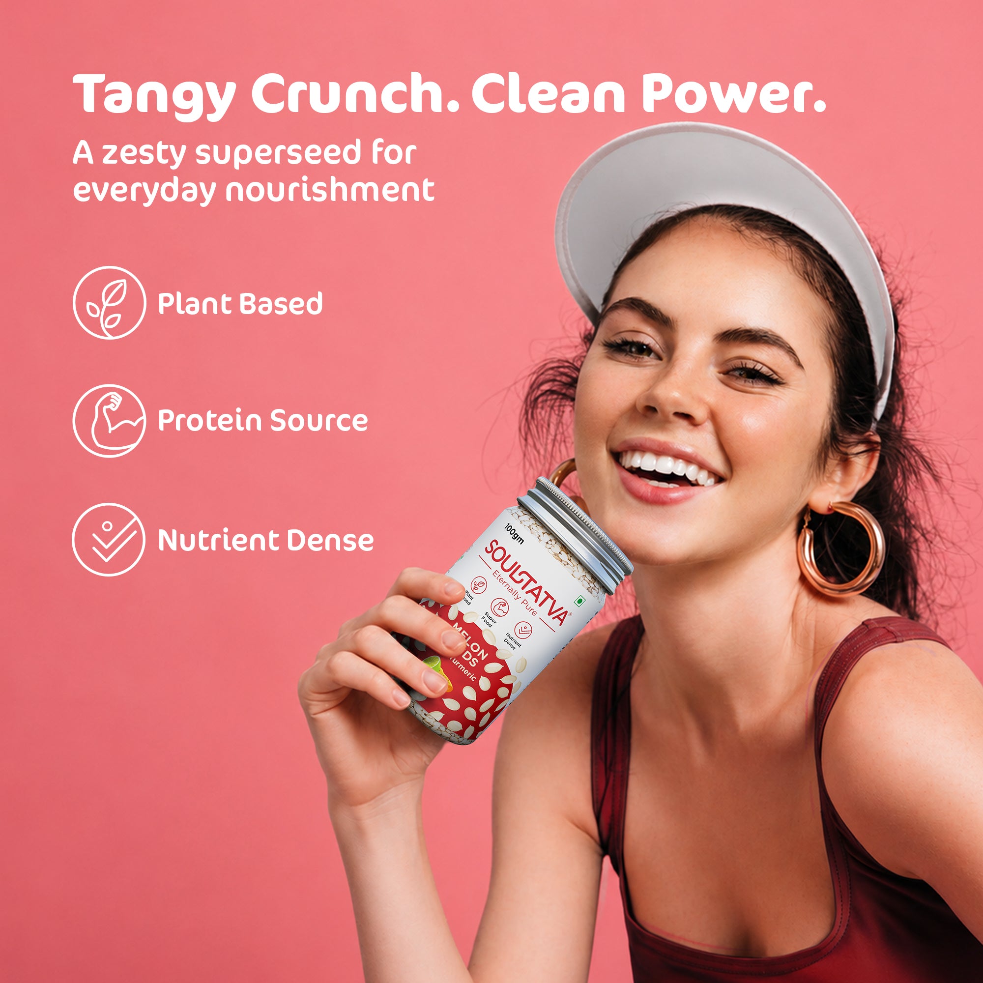 Soultatva Melon Seeds Tangy Turmeric 100gm tangy crunch clean power lifestyle shot, woman holding the jar, a zesty plant-based protein-rich superseed